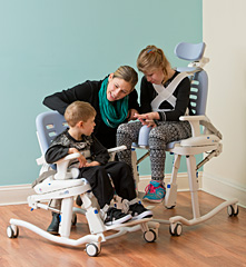 The Rifton HTS adapts to a childs size with adjustable features as shown with children that are several years apart in age. 
