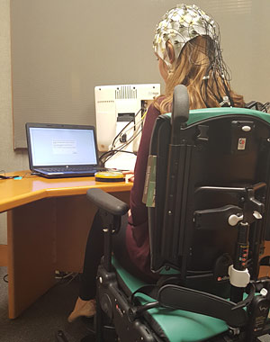 A girl sits in the activity chair for neurodevelopmental disorders studies