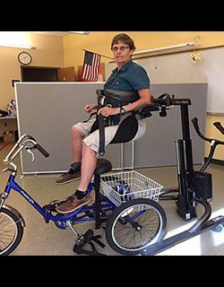 Using the Rifton TRAM to transfer a student over a special needs trike