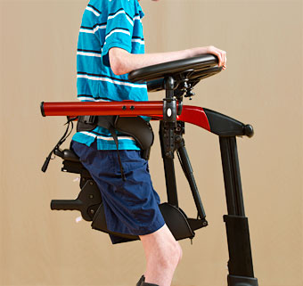 Side view of a patient being supported by prompts in a dynamic gait training device