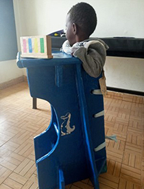A supportive stander made by APT Kenya