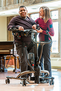 A rehabilitation patient with a bionic leg uses the Rifton TRAM to regain motor skills following a traumatic accident.