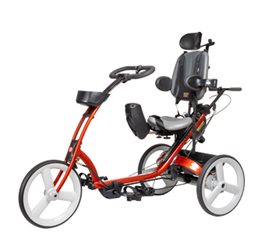 A red Rifton adaptive tricycle