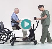 Using the Rifton TRAM, a caregiver assists an older client with a sit-to-stand transfer.